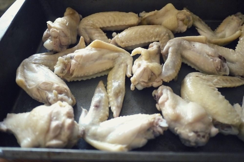 chicken wings baked on a baking sheet