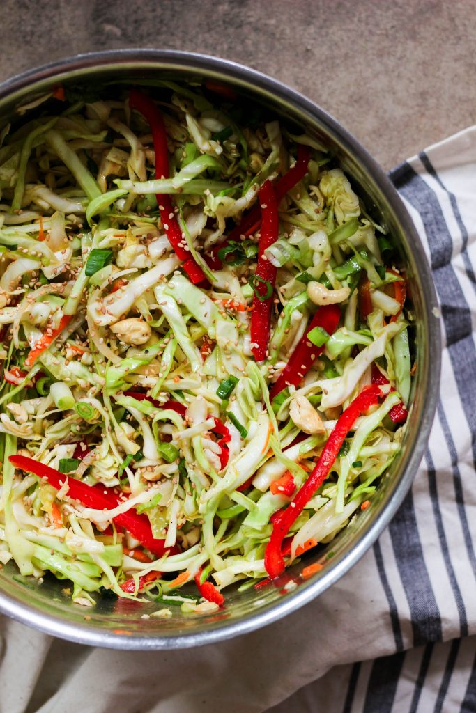 paleo Asian coleslaw mixed togehter in a mixing bowl