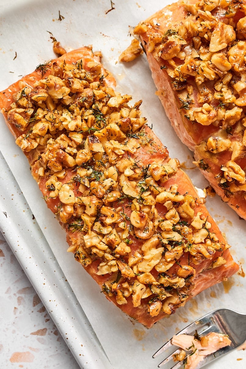 Close up view of salmon filet topped with dill walnut crust.