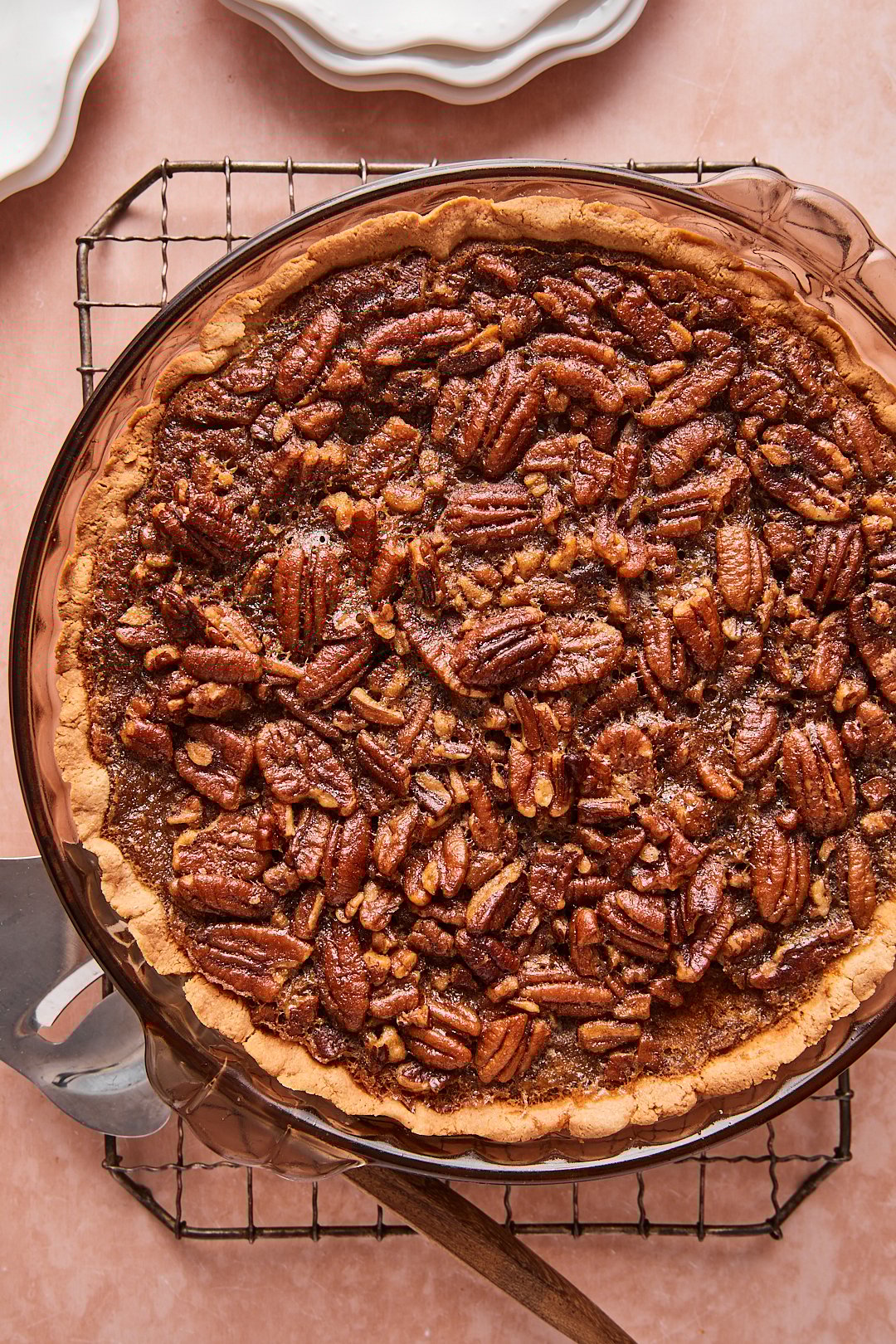 Close up shot of baked pumpkin pecan pie on top of a wire rack