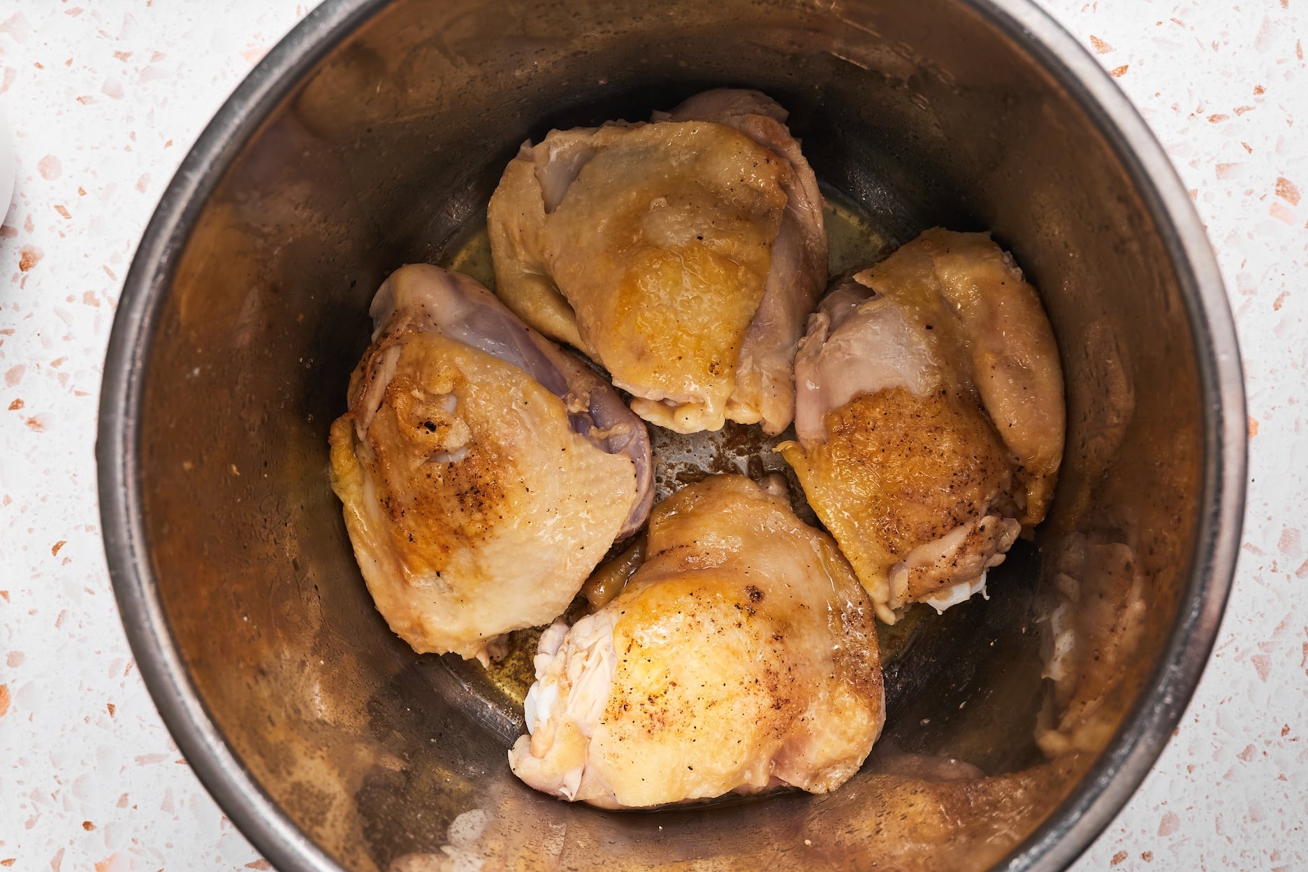 Browning chicken thighs in the Instant Pot.