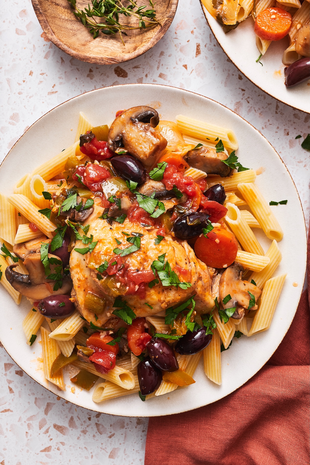 instant pot chicken cacciatore served over pasta garnished with parsley