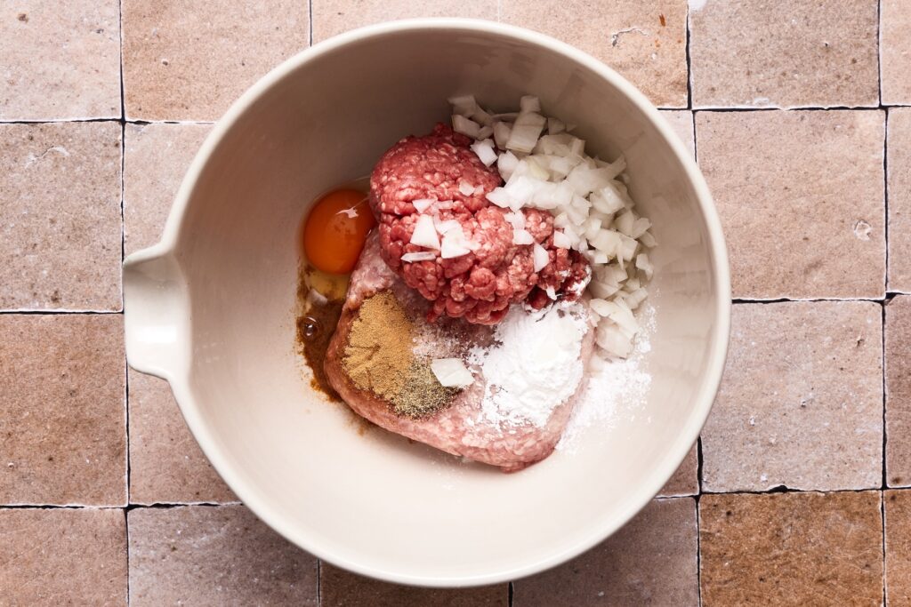Meatballs ingredients in a large bowl