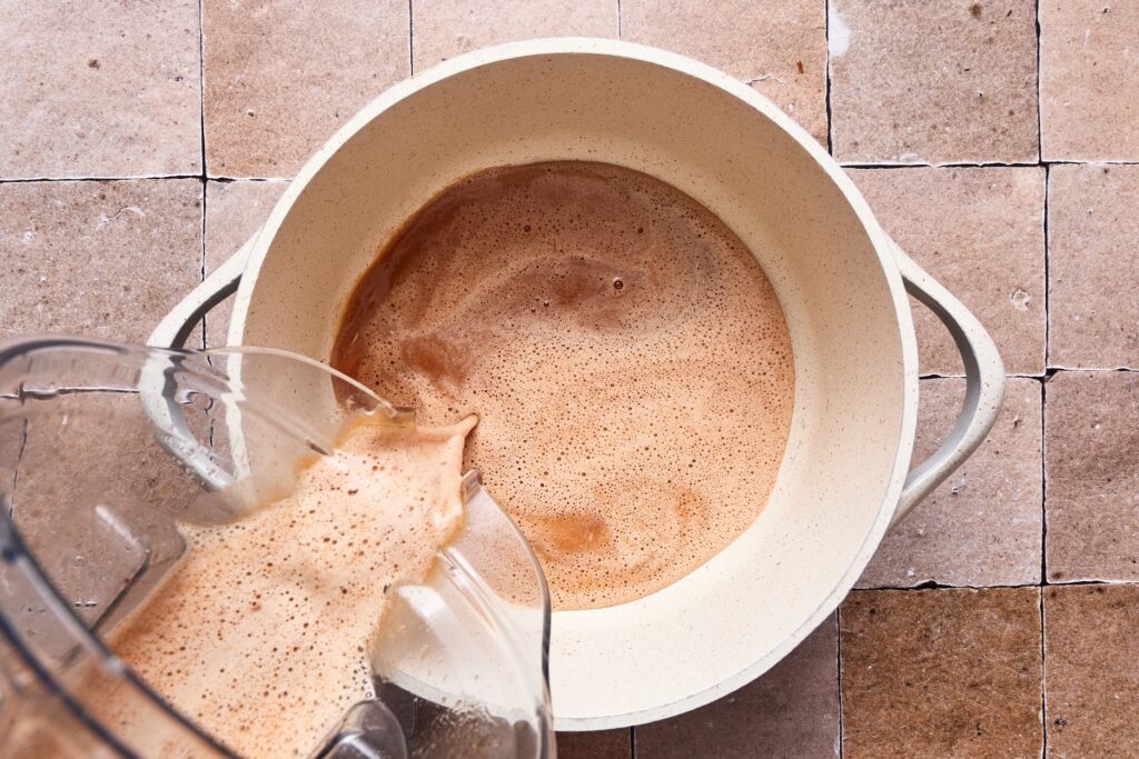 Pouring sweet and sour sauce into a saucepan