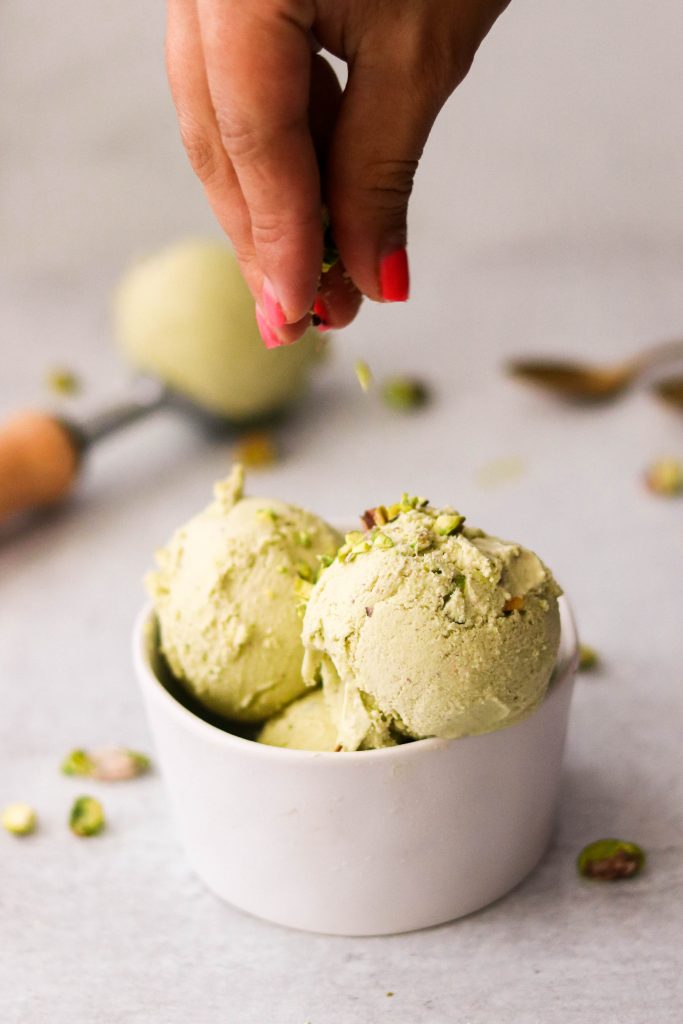 Homemade pistachio ice cream sprinkled with chopped pistachios