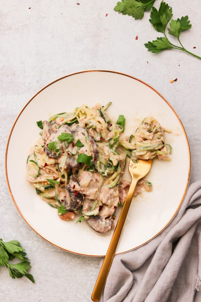 Paleo tuna zoodle casserole plated with a fork