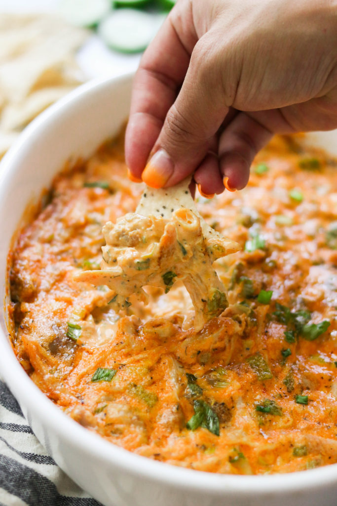 Grain free tortilla chip dipped in low carb buffalo chicken dip
