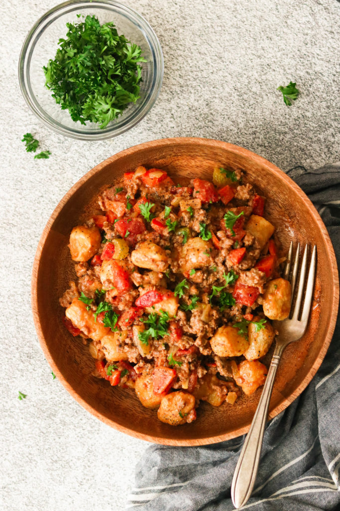 paleo gnocchi bolognese on a wooden plate