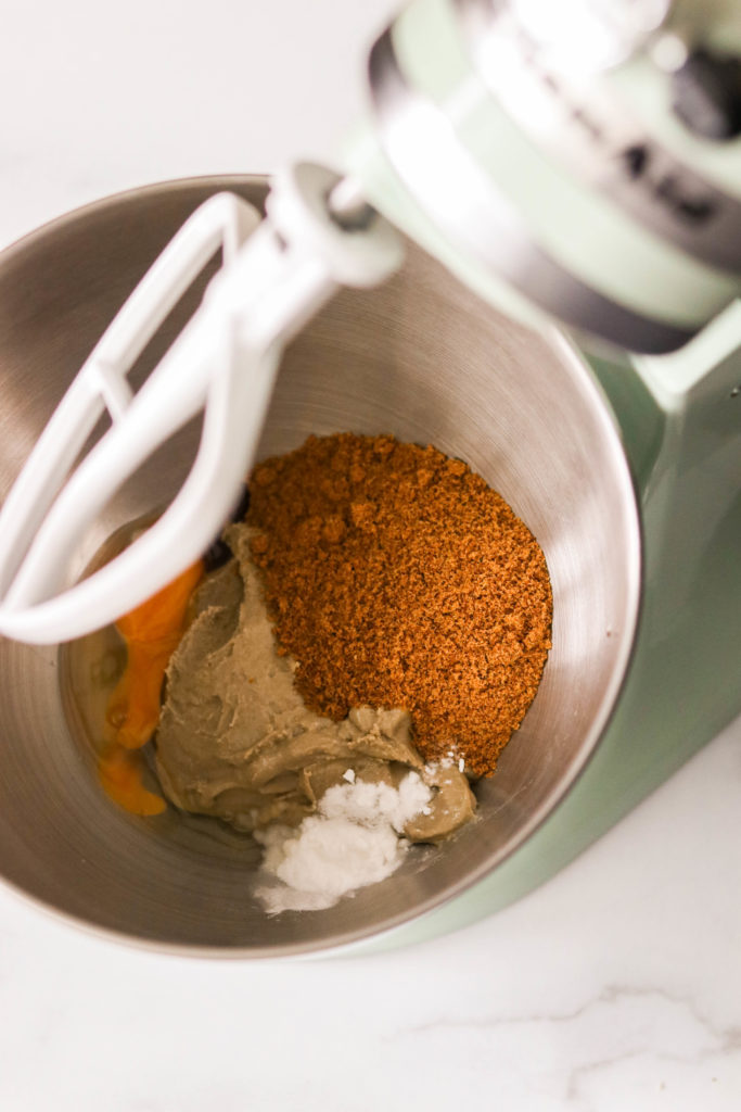 Ingredients for almond butter cookies in a mixer bowl