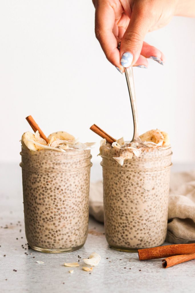 scooping up vegan chia pudding with a spoon