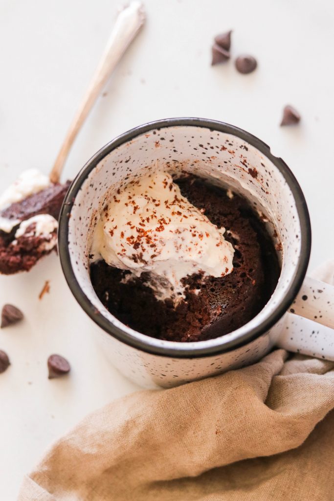 Flourless brownie in a mug with a spoon