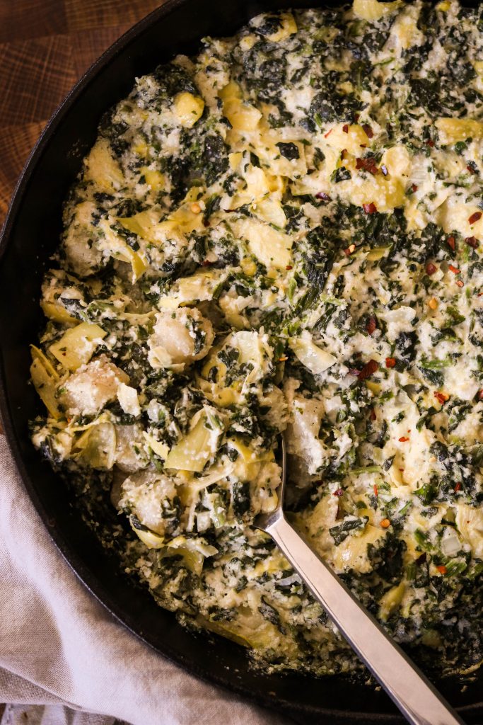 Spinach and Artichoke Baked Gnocchi Casserole with a spoon