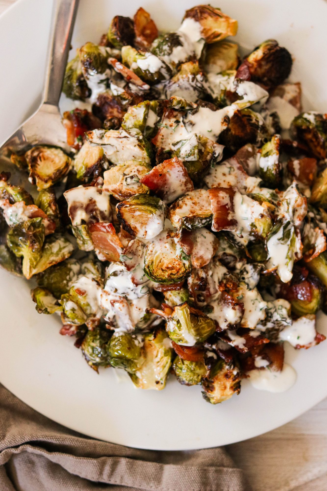an overhead view of crispy brussel sprouts with bacon and ranch