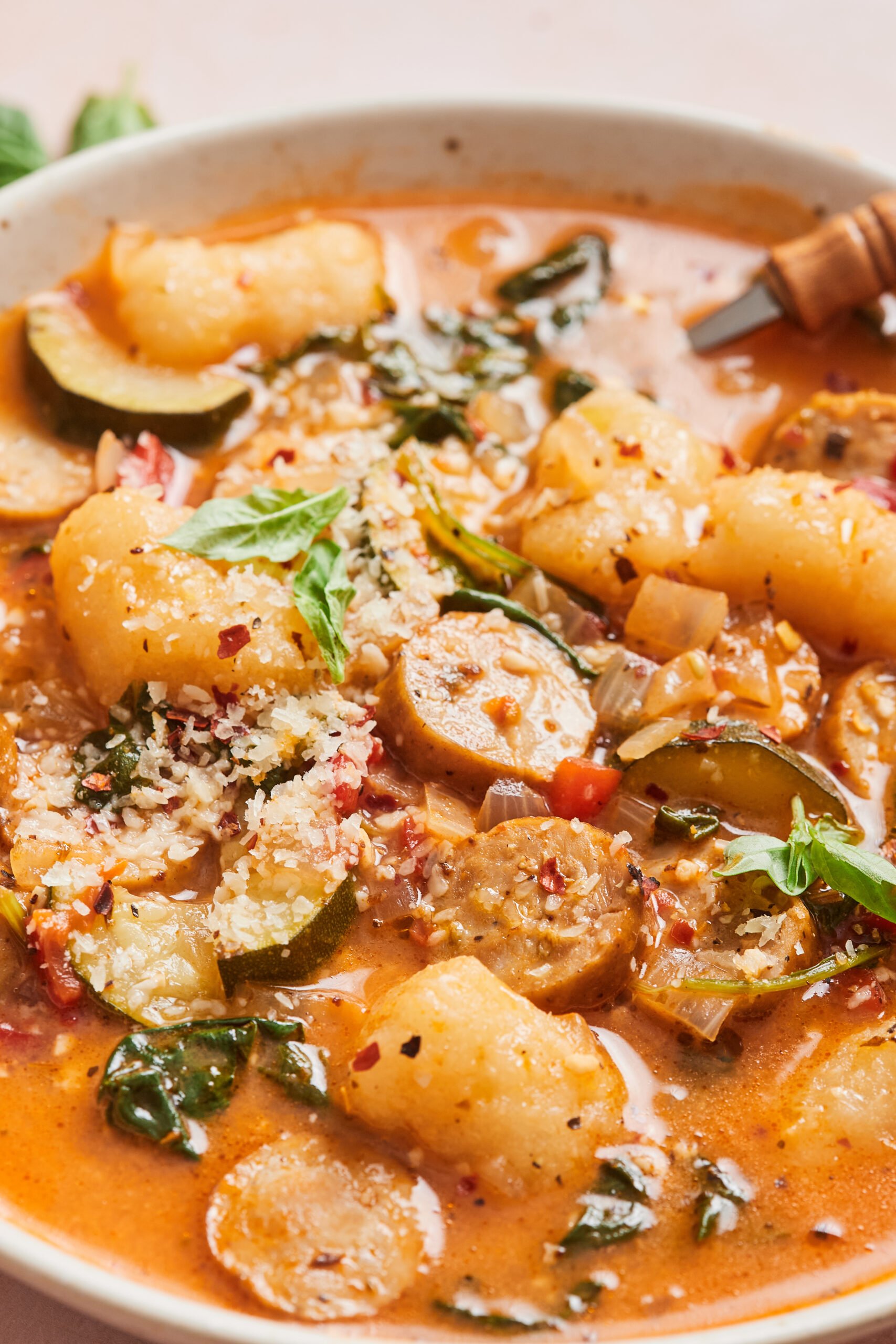 a close up of sausage gnocchi soup after simmering on the stovetop