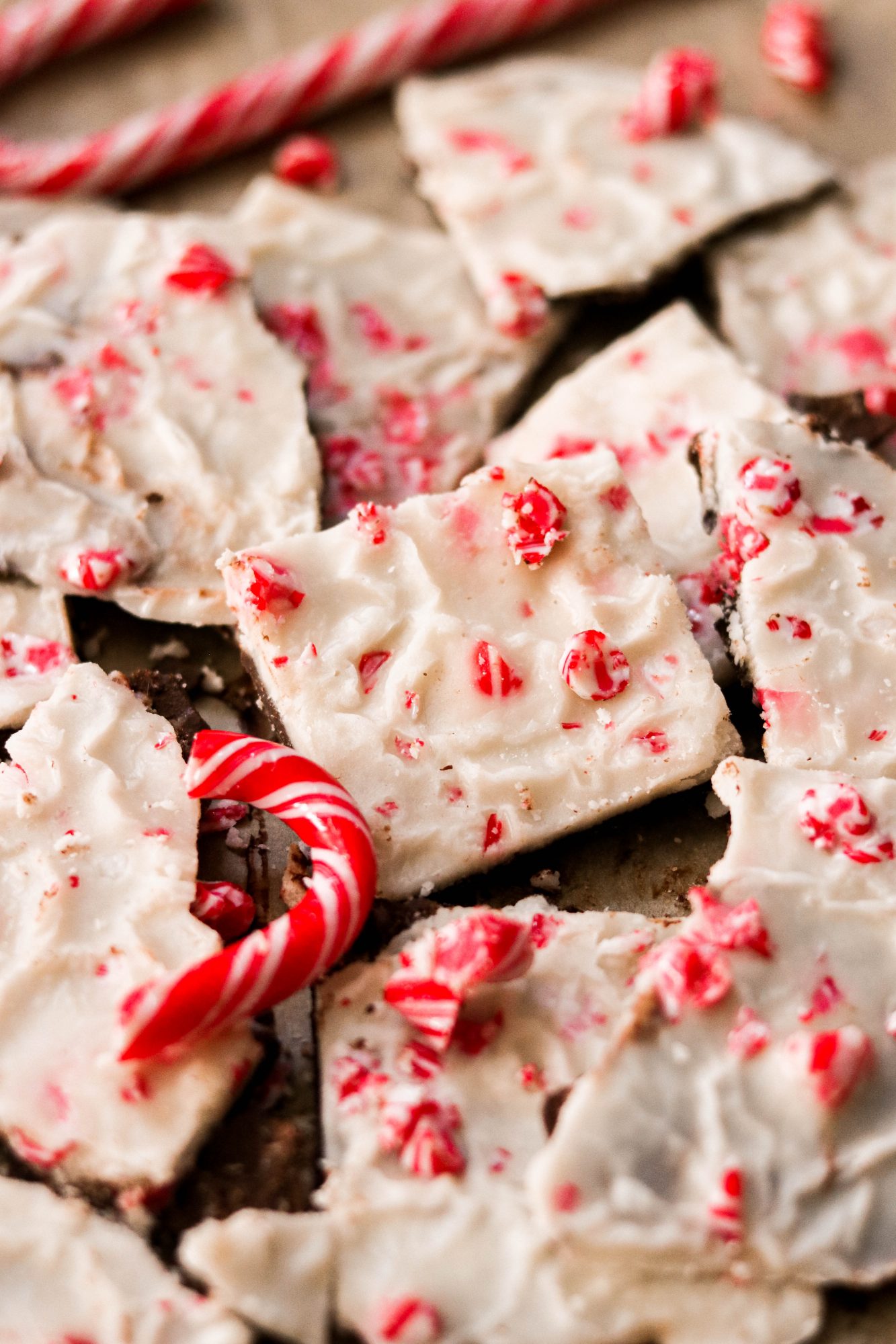 squares of vegan peppermint bark topped with candy cane pieces