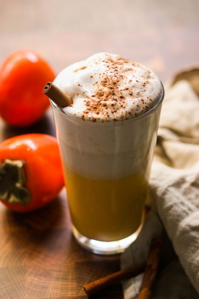 persimmon latte served in a glass