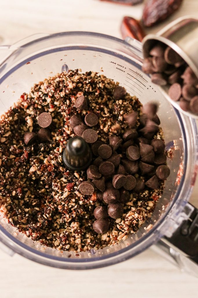 adding chocolate chips into the food processor