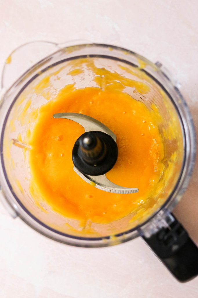 pureed mangos in a blender