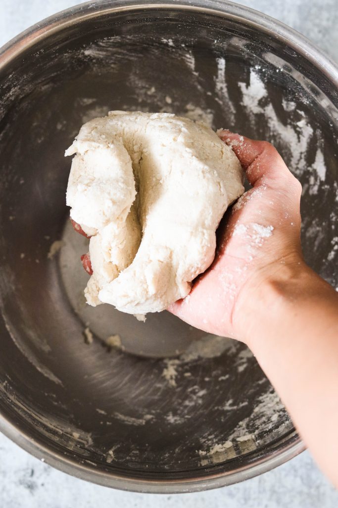 kneading dough to make homemade playdough