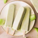 3 homemade melon bars on a white plate.