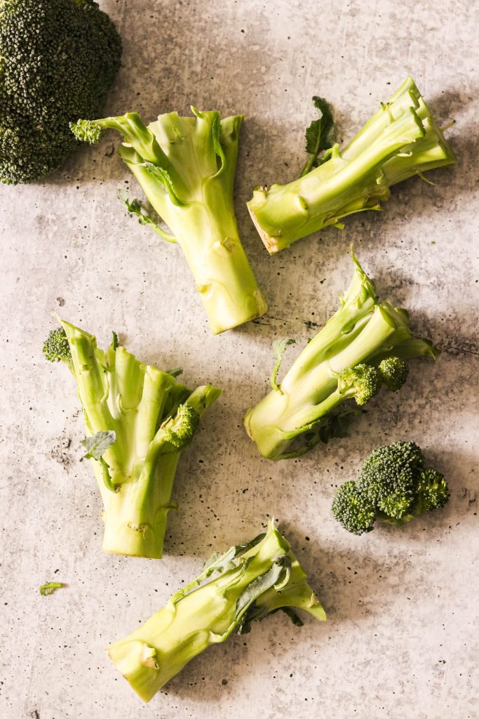 broccoli stems cut to make paleo broccoli slaw recipe
