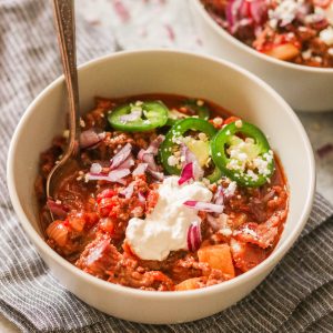 Chili con carne served in a bowl with spoon