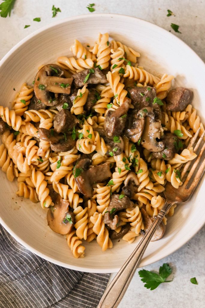 paleo beef stroganoff served in a bowl with grain free pasta