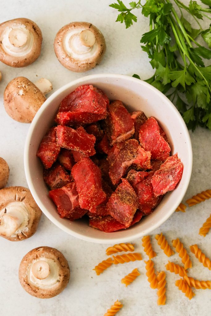 Beef stew meat seasoned with spices to be used for healthy instant pot beef stroganoff