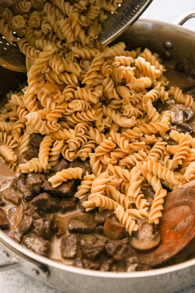 Add noodles to beef and mushroom sauce