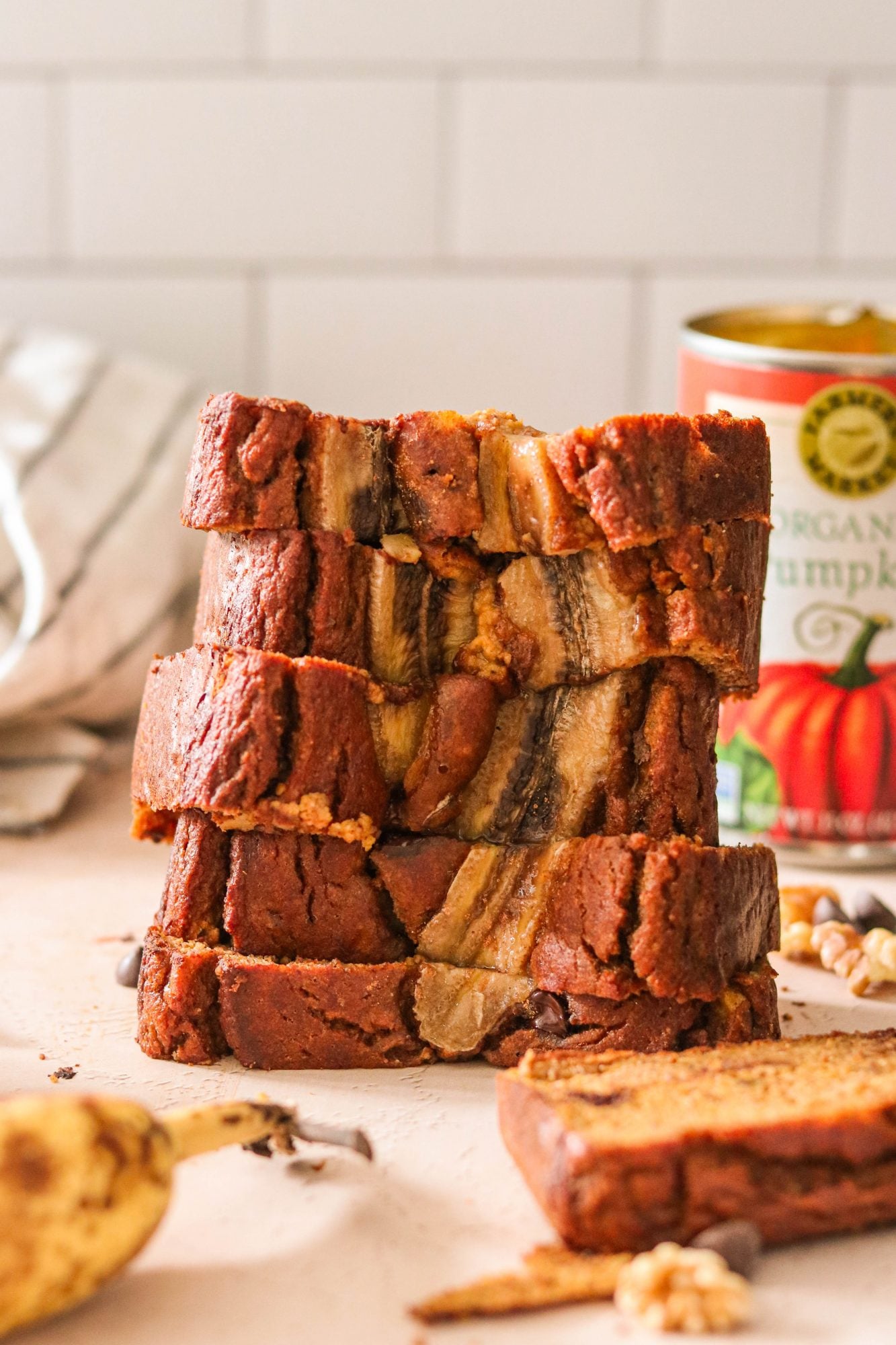 healthy gluten free banana bread slices stacked on top of another
