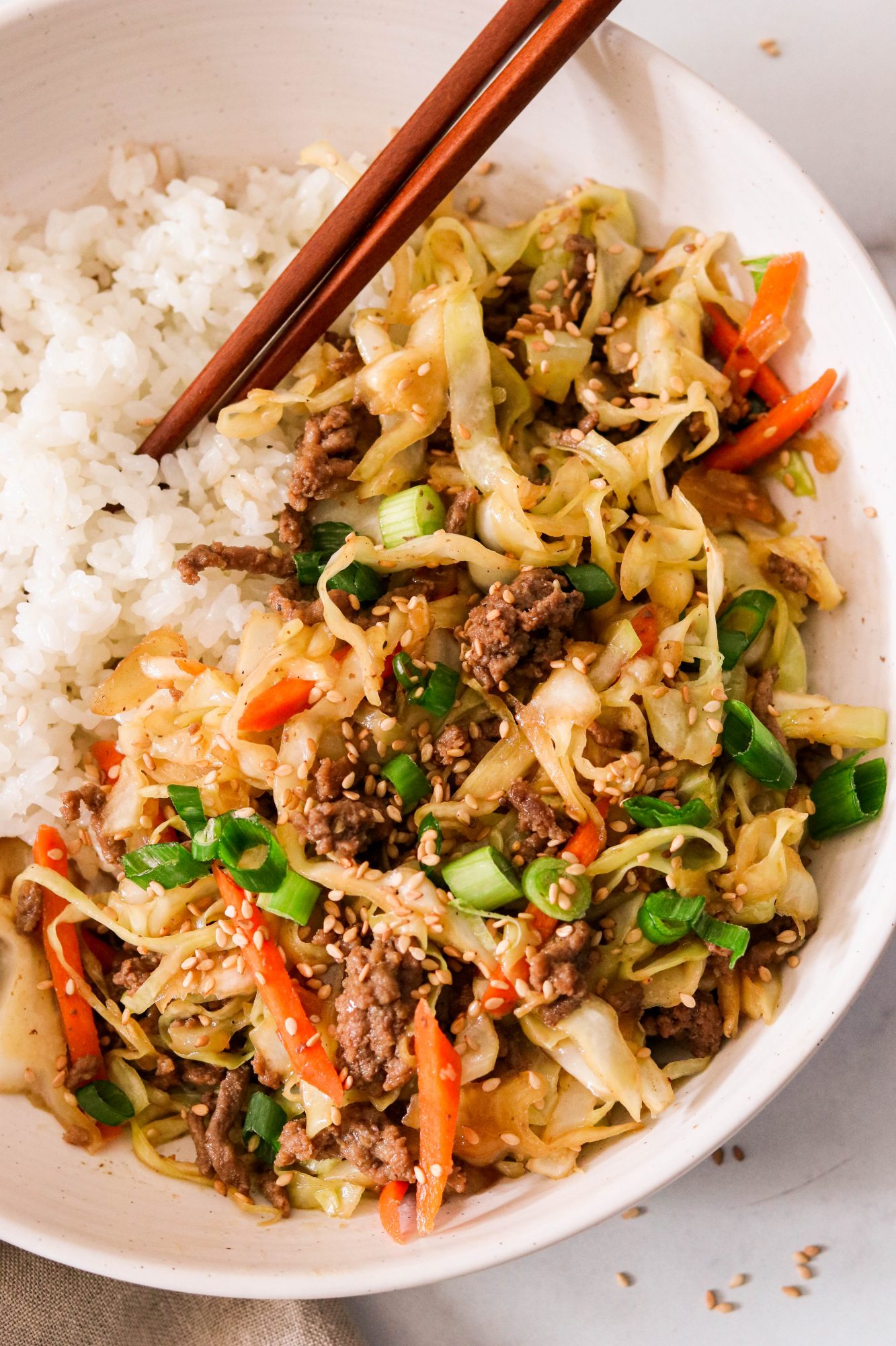 ground beef cabbage stir fry in a bowl with rice