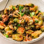 kimchi brussels sprouts served in a bowl