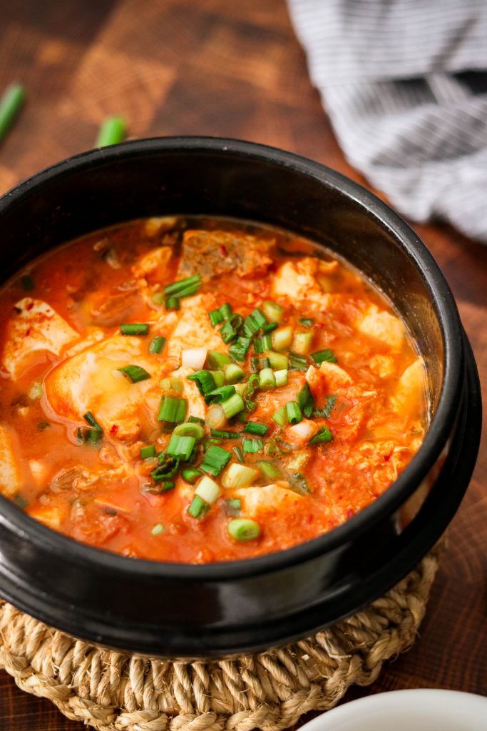 Korean spicy tofu soup served in earthenware pot
