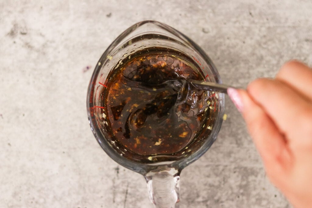 Ingredients for egg roll sauce mied together in a cup