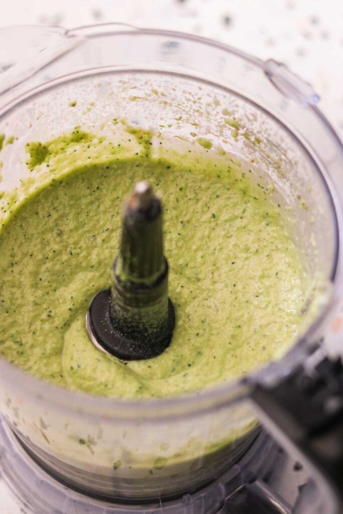 Avocado zucchini hummus blended until creamy in the blender.