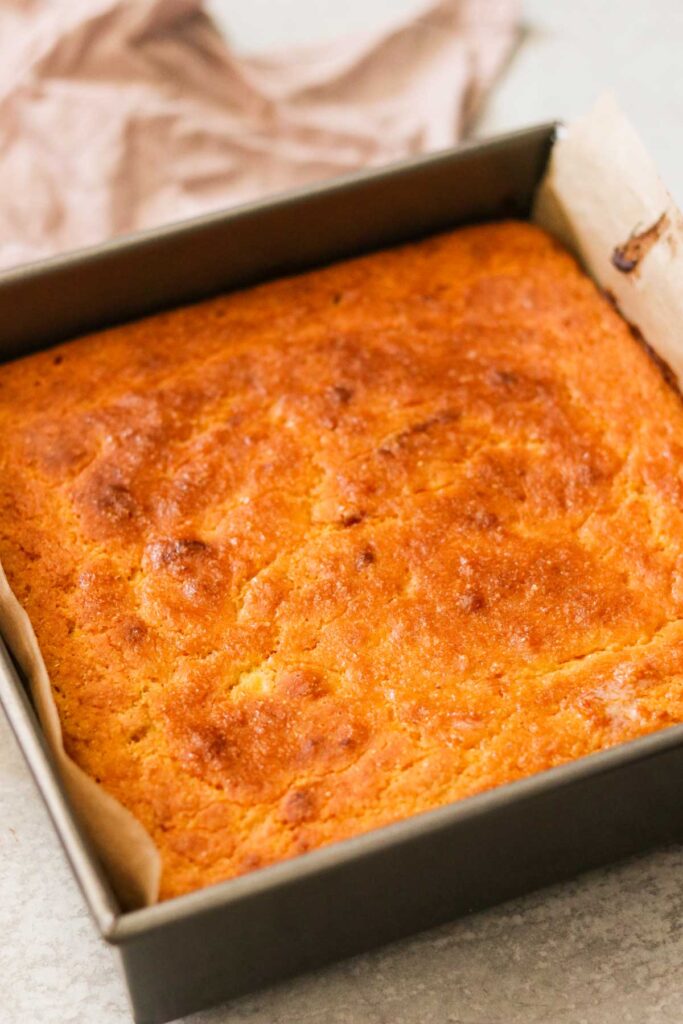 Freshly baked gluten free cornbread with a shiny, golden top