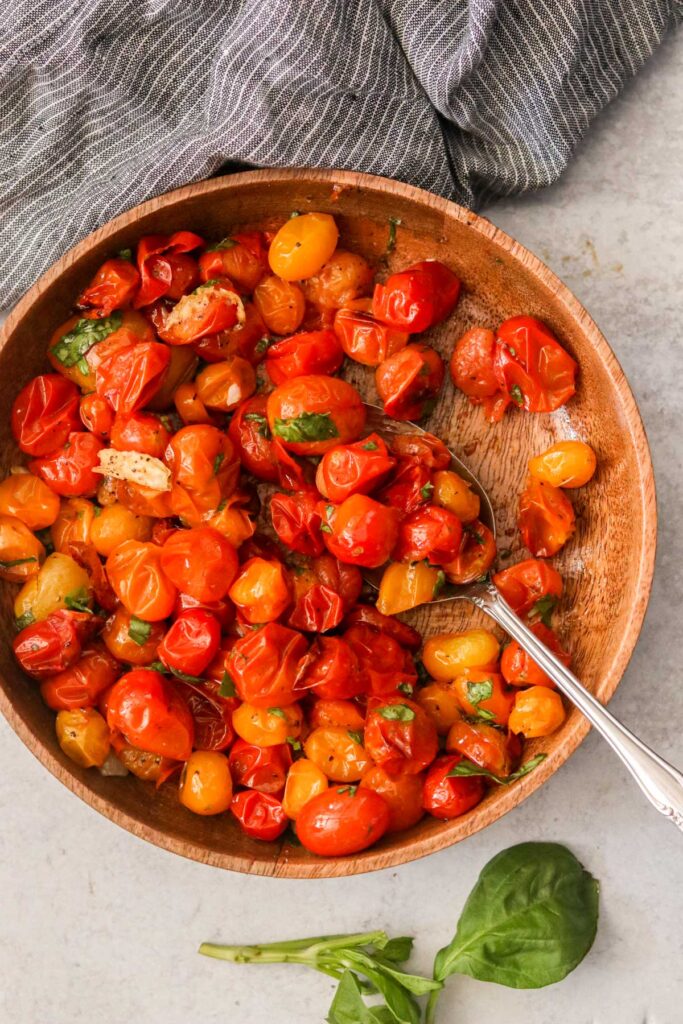 Blistered cherry tomatoes in a bowl