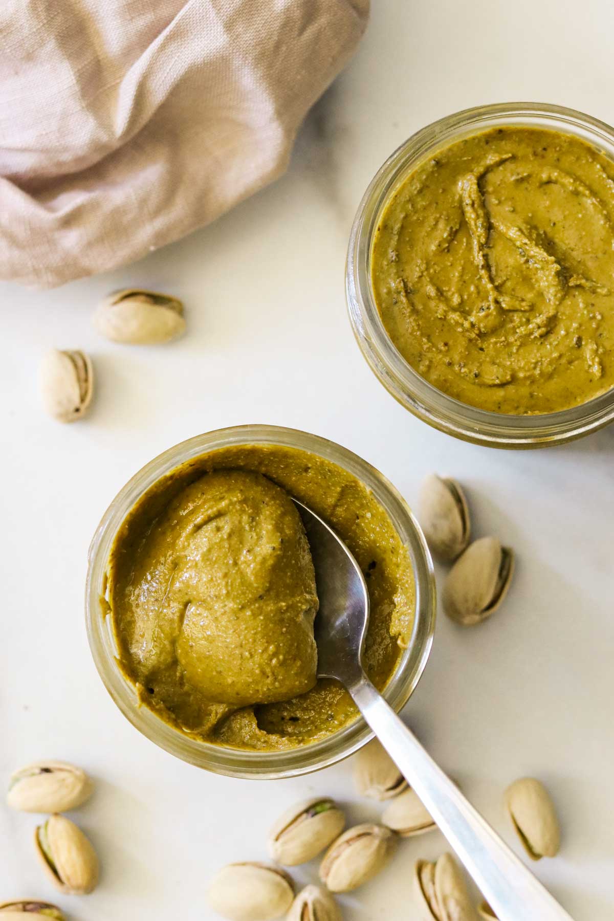 Spooning a big dollop of pistachio butter