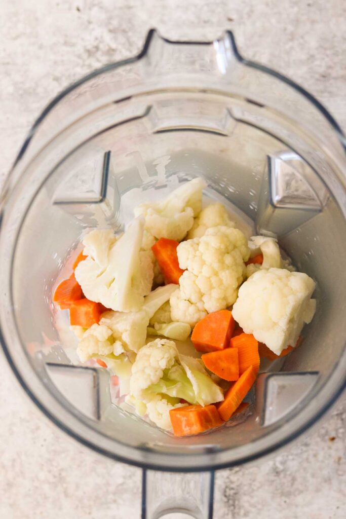 steamed cauliflower and sweet potatoes in a blender with milk
