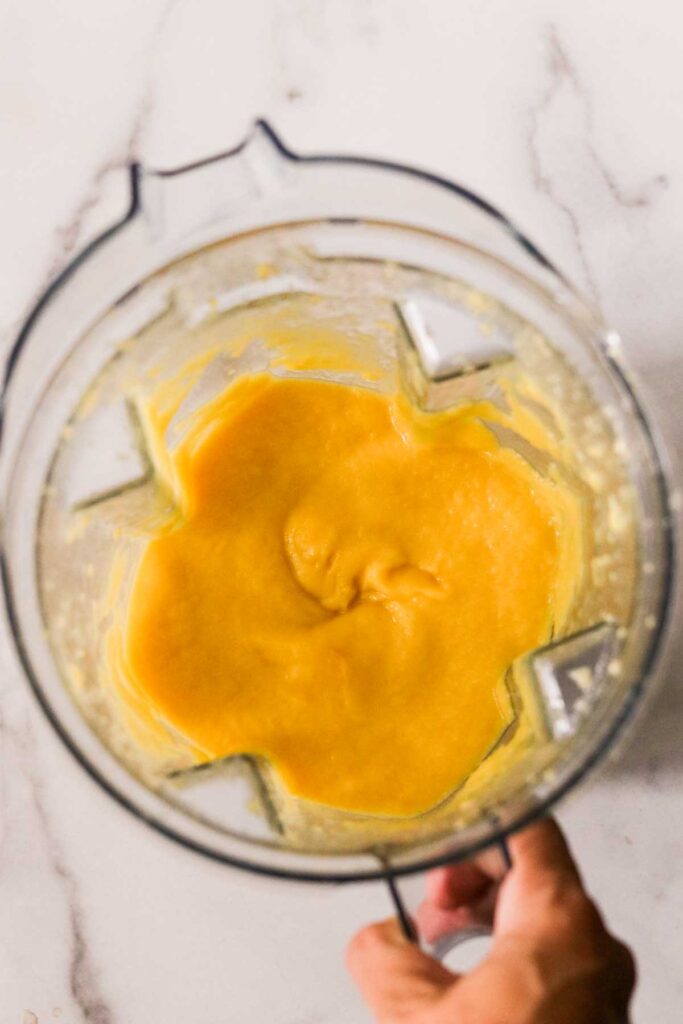 Mangos pureed in a blender.