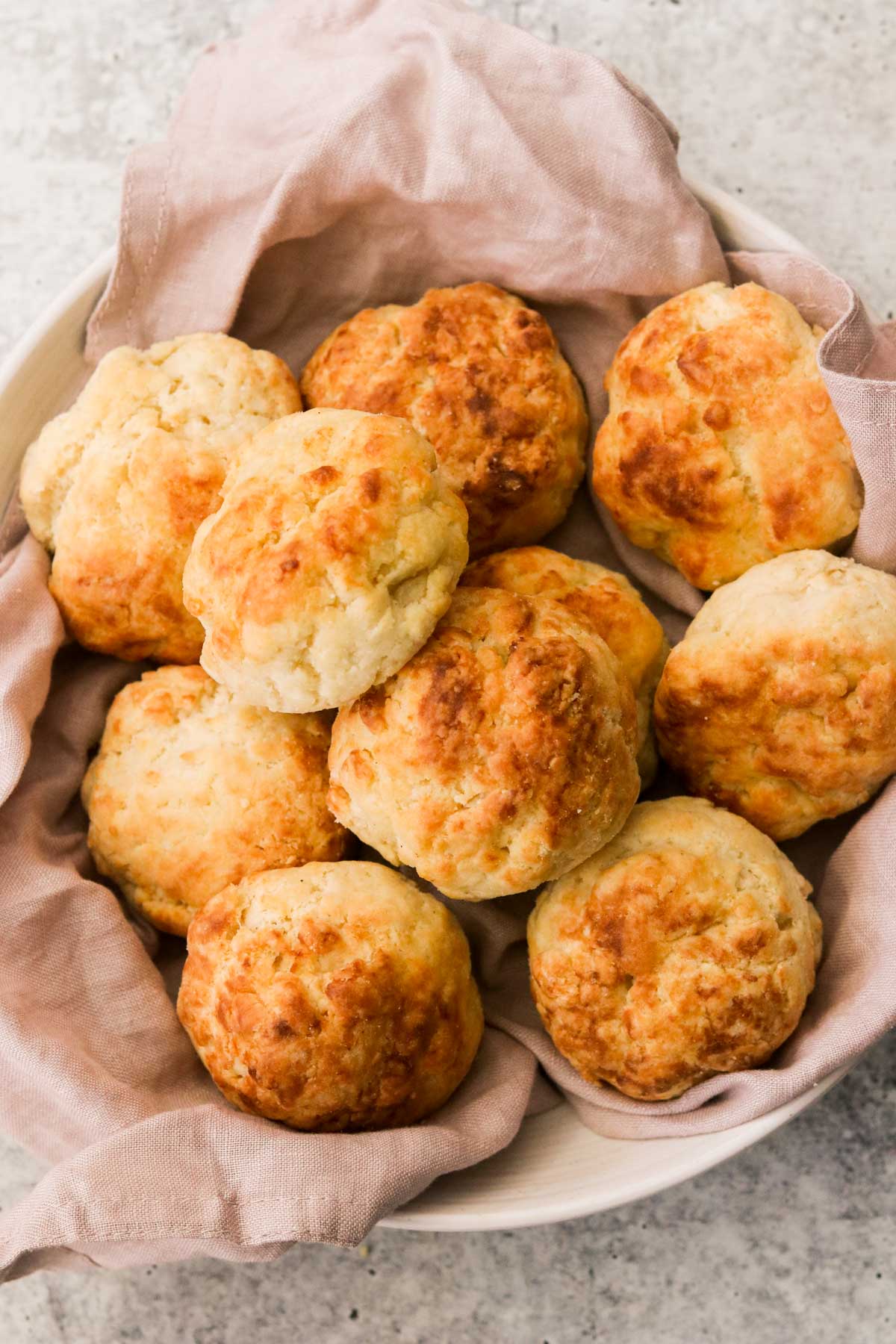 ten air fryer biscuits in a bowl