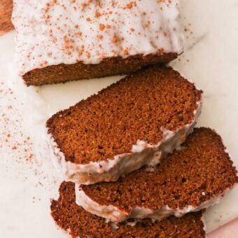 slices of gluten free gingerbread loaf with a white backround