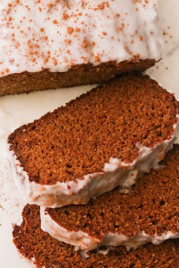 slices of gluten free gingerbread loaf with a white backround