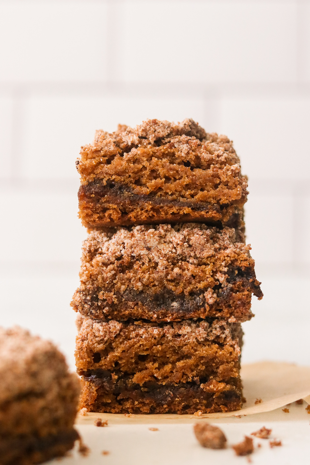 three slices of vegan coffee cake stacked on top of each other