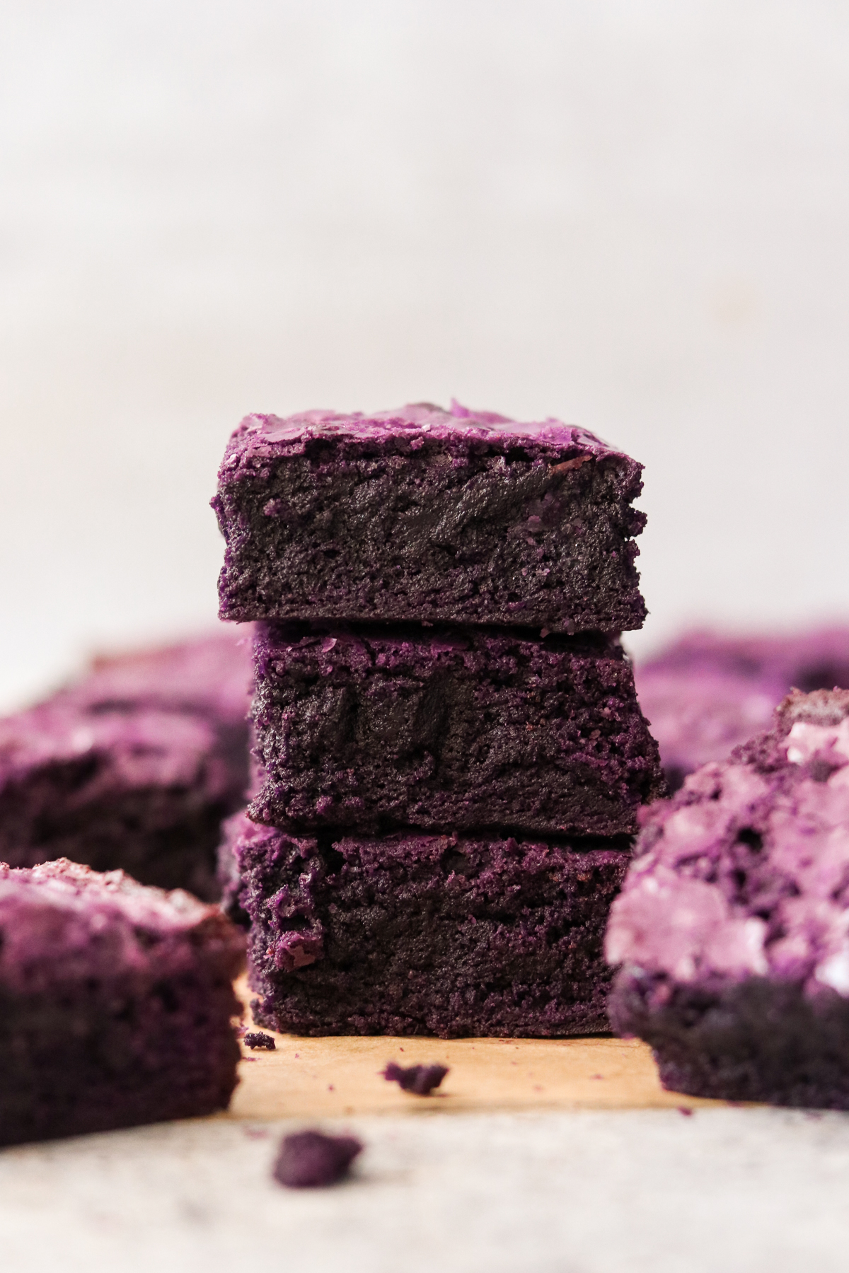 3 ube brownies stacked on top of each other