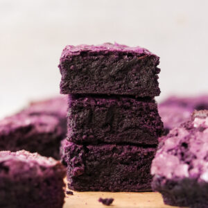 3 ube brownies stacked on top of each other