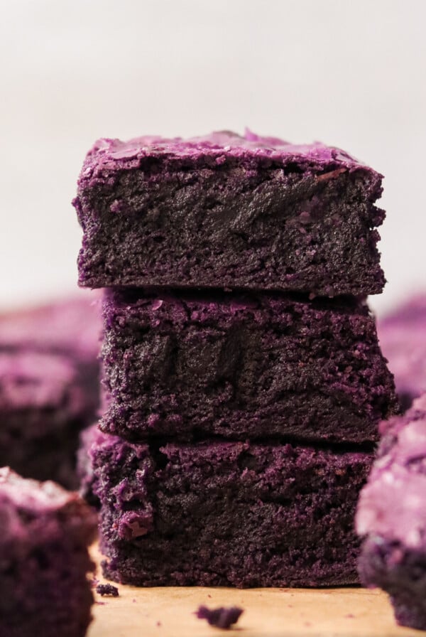 3 ube brownies stacked on top of each other
