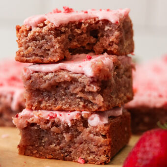 three strawberry brownies stacked on top of each other