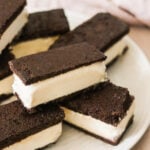 gluten-free ice cream sandwiches stacked on top of a white plate