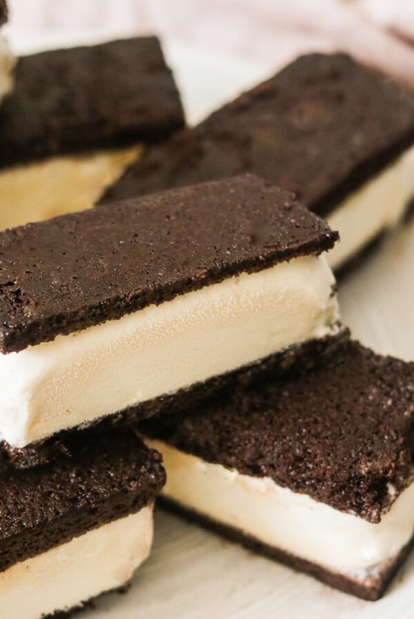 gluten-free ice cream sandwiches stacked on top of a white plate